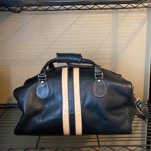 Black leather duffle travel bag w/shoulder strap.
